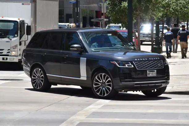 black range rover on road - How Much Range Rover